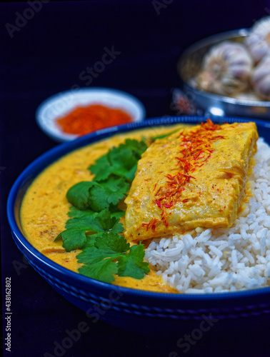 Fish in curry with rice. Indian cuisine.