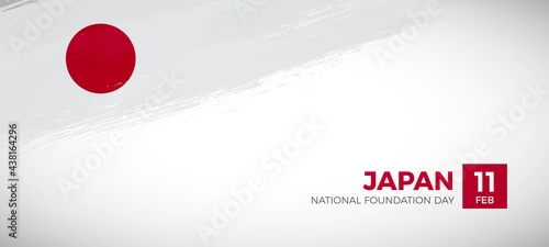 Happy national foundation day of Japan with brush painted grunge flag background