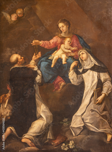 RAVENNA, ITALY - JANUARY 28, 2020: The painting of Madonna with the St. Dominic and Catherine of Siena in church Basilica di Santa Maria del Porto by Andrea Barbiani from 18. cent.