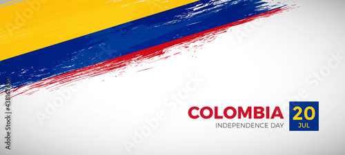 Happy independence day of Colombia with brush painted grunge flag background