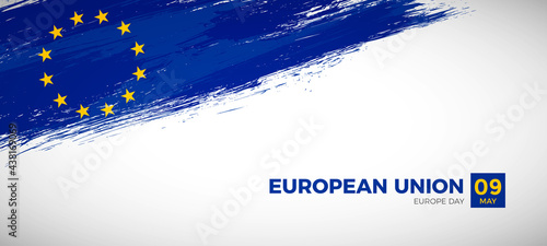 Happy europe day of European Union with brush painted grunge flag background photo