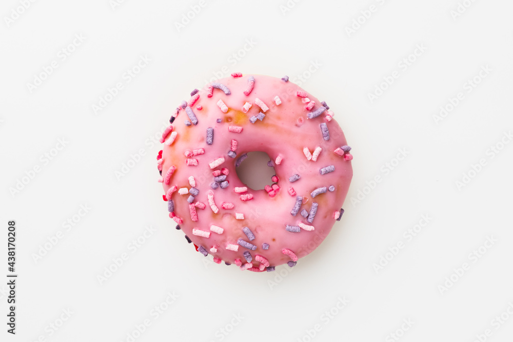 pink donut against white background pink donut against white background