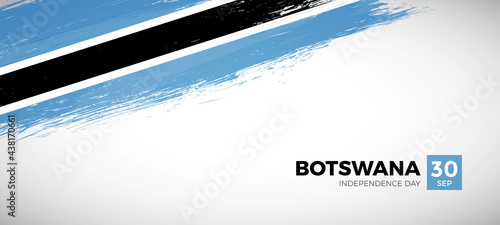 Happy independence day of Botswana with brush painted grunge flag background