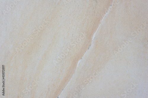 Stone marble slate wall background in warm tones and sharp detail photo