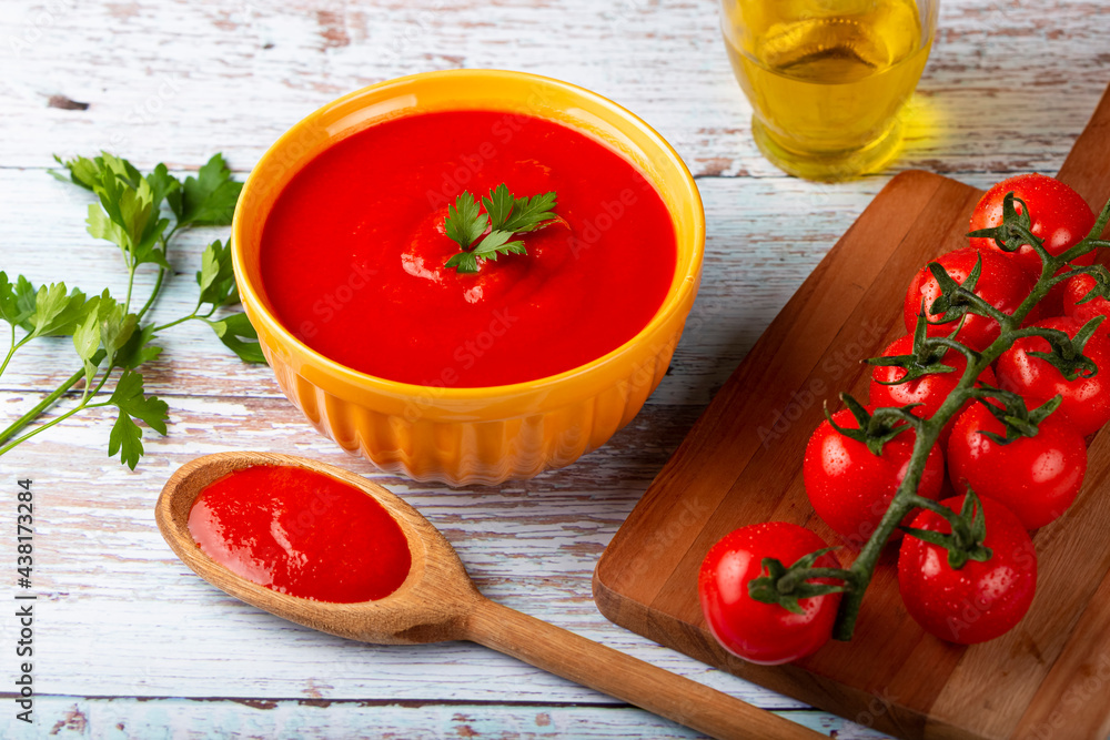 Delicious homemade tomato soup in bowl. Delicious homemade tomato soup in bowl.