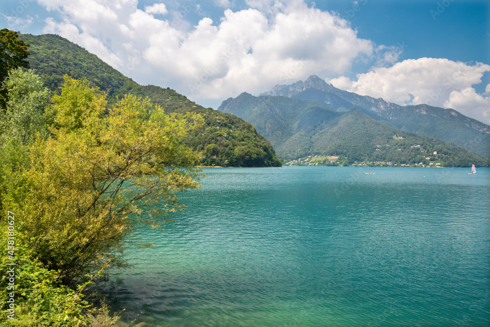 The lake Lago di Ledro among the Alps in the Trentino district .