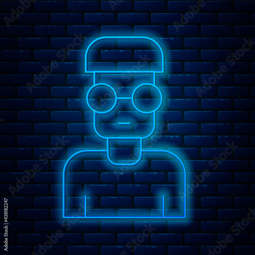Glowing neon line Nerd geek icon isolated on brick wall background. Vector