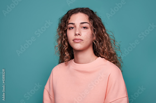 Cool youngster standing in studio