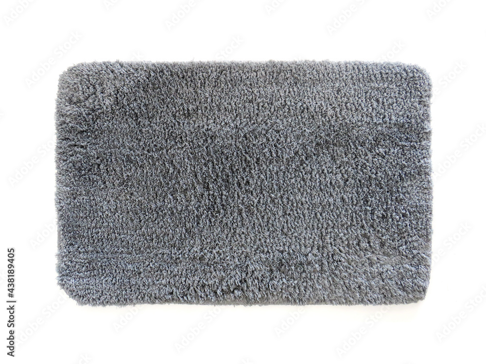 Clean bathroom doormat isolated on white. Aerial view of microfiber bath mat with gray hair. Thick absorbent and non-slip mat. Antibacterial shower mat. Complement of bathroom, kitchen. - obrazy, fototapety, plakaty 