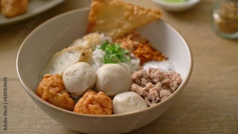spicy small flat rice noodles with fish balls and shrimp balls without soup - Asian food style spicy small flat rice noodles with fish balls and shrimp balls without soup - Asian food style