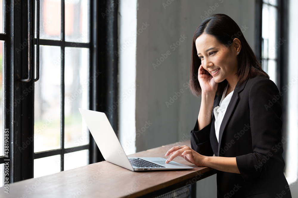 businesswoman working with laptop computer in office businesswoman working with laptop computer in office