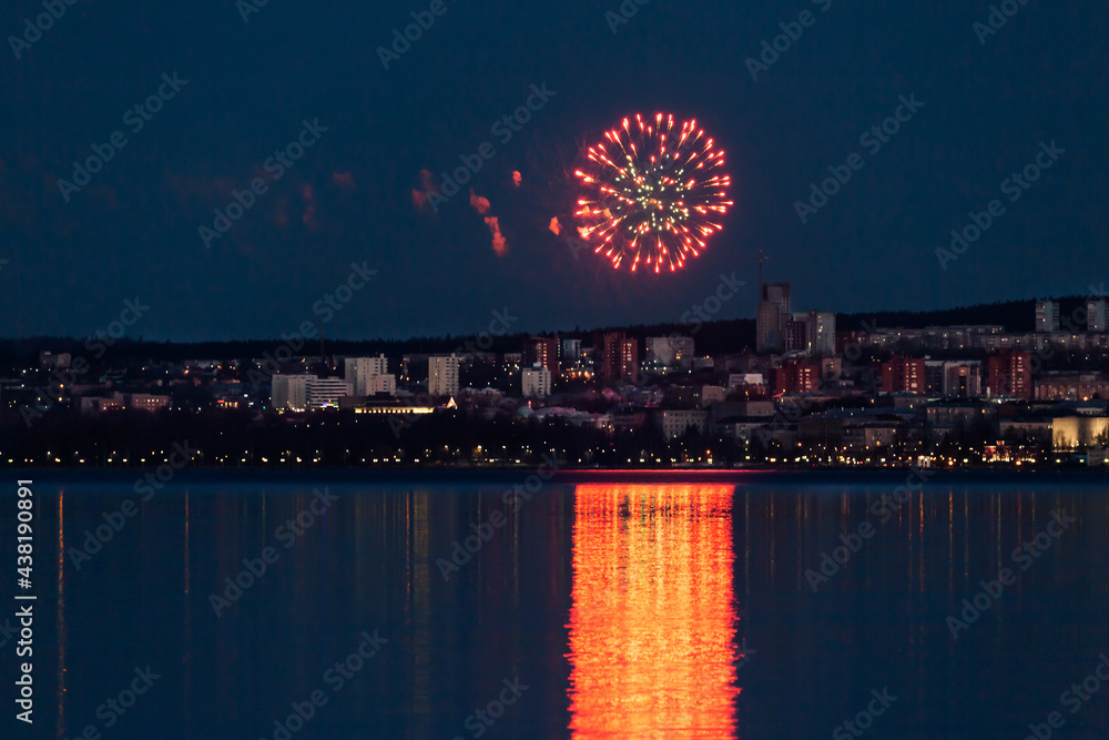 Fireworks in the night sky above over the city of Petrozavodsk in Karelia, Russia.
