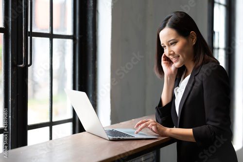 businesswoman working with laptop computer in office