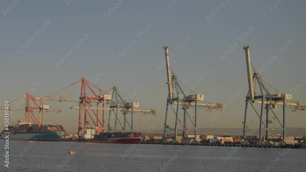 View of Port Limassol with cargo ships and cranes on dock. View of Port Limassol with cargo ships and cranes on dock.