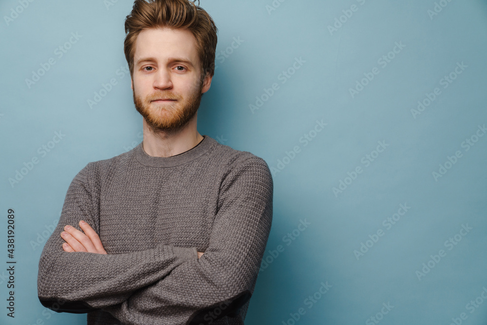 White ginger man looking at camera while posing with arms crossed White ginger man looking at camera while posing with arms crossed
