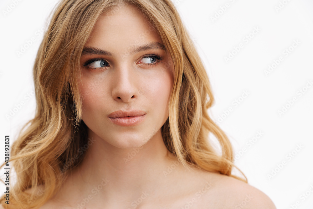 Half-naked ginger woman posing and looking aside Half-naked ginger woman posing and looking aside