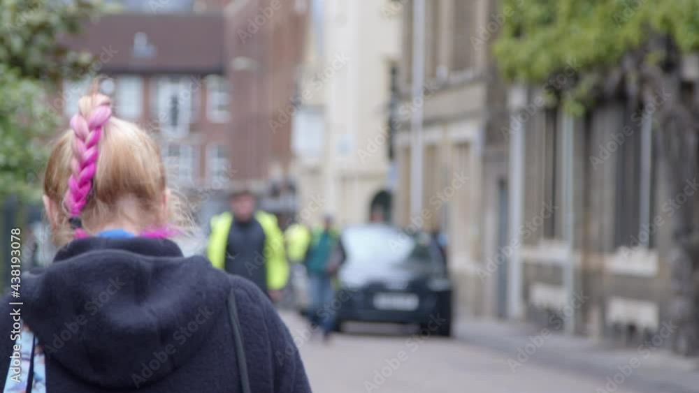 Tracking Shot Following Person with Pink Hair In Street Tracking Shot Following Person with Pink Hair In Street