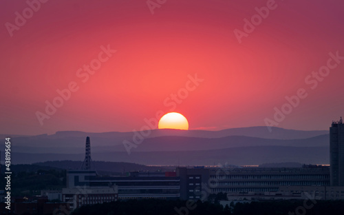 Sunset over the hills in clear weather gorizon clouds photo