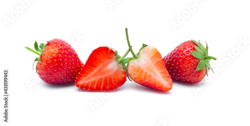 Fresh red ripe strawberries with leaf isolated on white background.