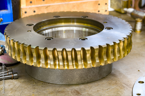 Worm shaft and worm wheel in a locksmith's workshop on the assembly of the gearbox. photo