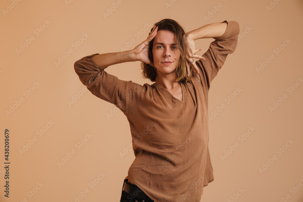 Young white man in shirt dancing and looking at camera Young white man in shirt dancing and looking at camera