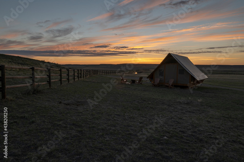 Sunrise on a tent at Grasslands National Park  Saskatchewan  Canada