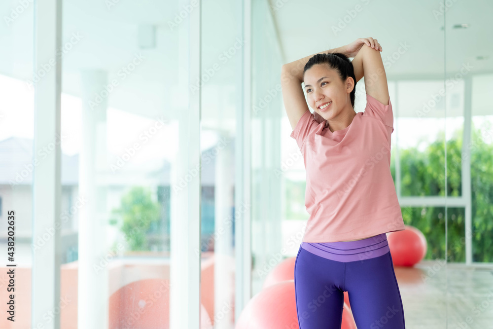 Asian women stretching and warm up before exercise Asian women stretching and warm up before exercise