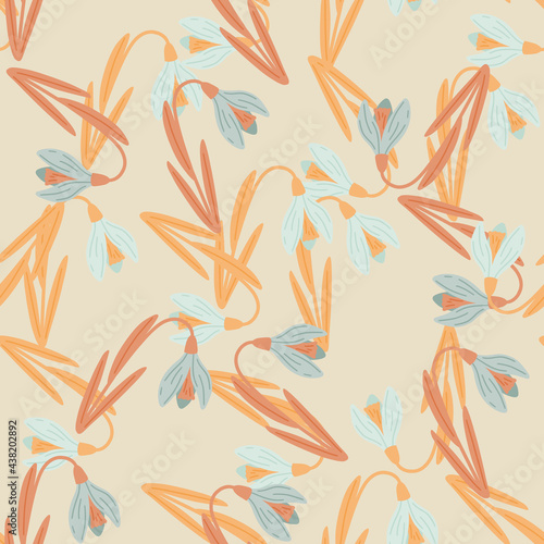 Orange and blue colored spring snowdrop elements seamless pattern. Beige background. Nature artwork.
