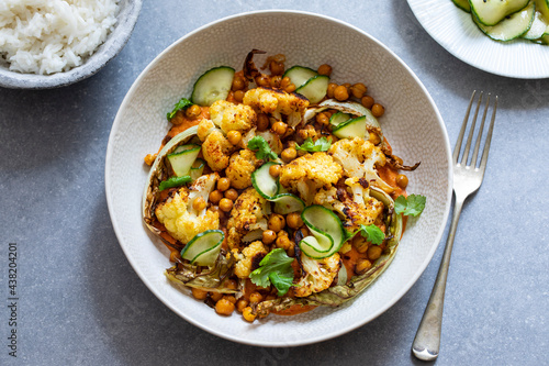 Roast cauliflower and chickpeas with pickled cucumber and red pepper sauce
