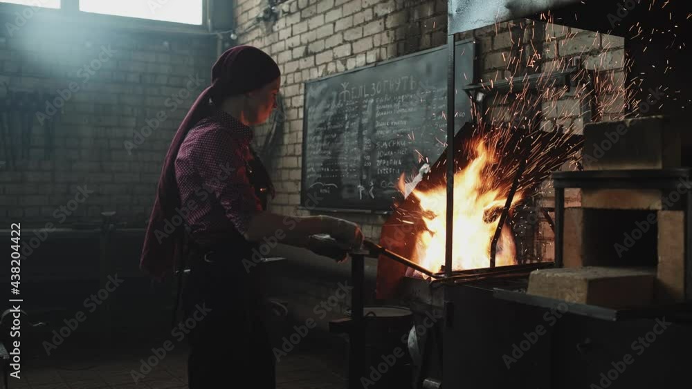 blacksmith girl working in her workshop blacksmith girl working in her workshop