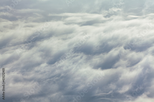 Fototapeta Naklejka Na Ścianę i Meble -  Gray Cloudy Sky Wallpaper . Flight over the Clouds 