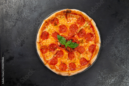 pepperoni pizza on a dark background. close-up.