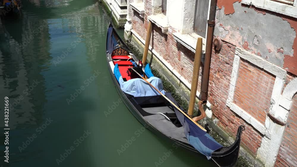 Venice, Italy - gondolas and gondoliers in the Grand Canal near the Rialto Bridge, in the San Marco Basin and between the canals of the lagoon city Venice, Italy - gondolas and gondoliers in the Grand Canal near the Rialto Bridge, in the San Marco Basin and between the canals of the lagoon city