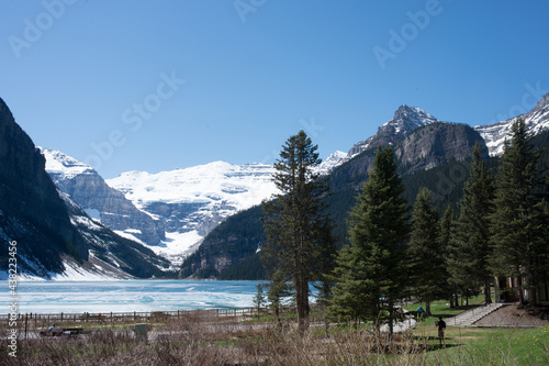 Beautiful landscape with Lake Louise and snowed mountains around. Spring at Banff National Park, Alberta, Canada. America