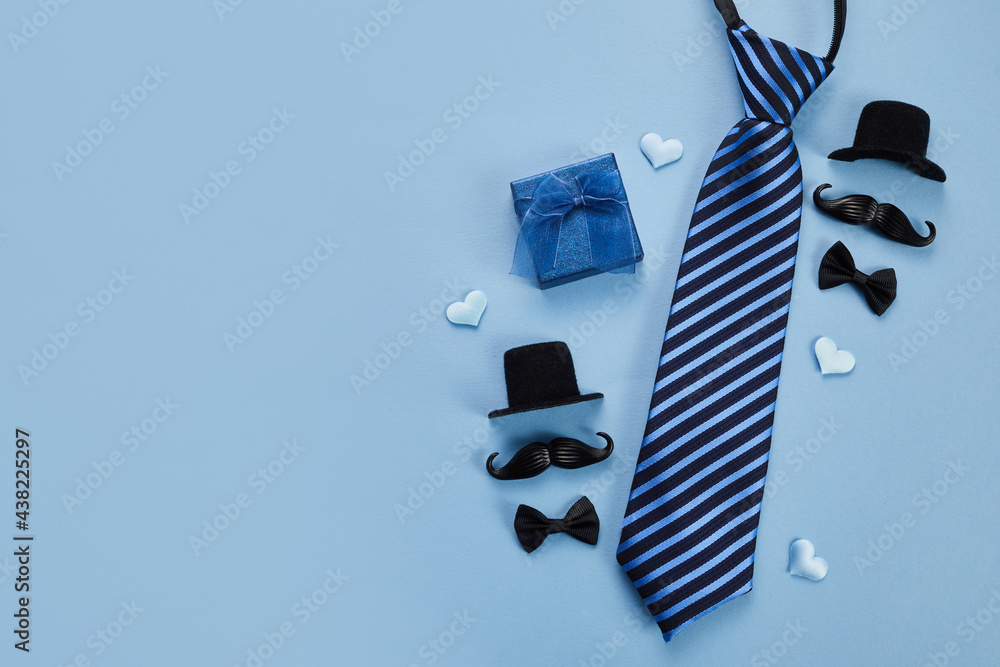 Father's Day poster or banner with necktie and decorations on blue background. Greetings for Father's Day. Flat lay styling. - obrazy, fototapety, plakaty 
