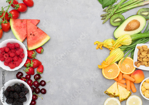 Healthy food. colored and various Vegetables and fruits on grey background