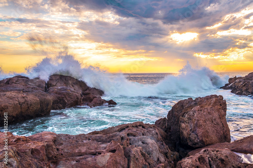 View of a rocky Cape Town city coastline at sunset, Cape Town, South Africa from Blouberg Beach photo