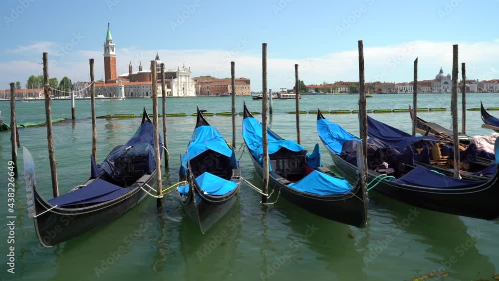 Venice, Italy - gondolas and gondoliers in the Grand Canal near the Rialto Bridge, in the San Marco Basin and between the canals of the lagoon city Venice, Italy - gondolas and gondoliers in the Grand Canal near the Rialto Bridge, in the San Marco Basin and between the canals of the lagoon city