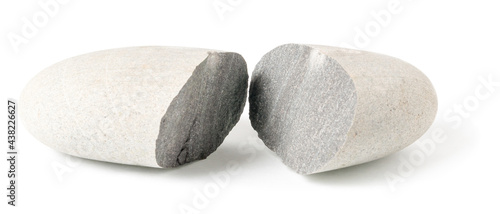 Single split grey pebble isolated on white