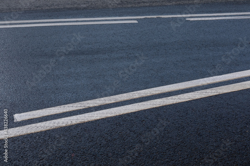 Road markings on the asphalt. Public transport stop zone and intermittent white line © Naletova