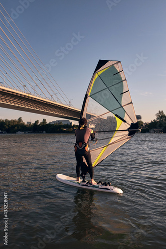 Windsurfer surfing on a windy day at the river.