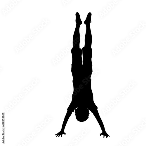 Obraz na plátně Silhouette boy pose Handstand sport
