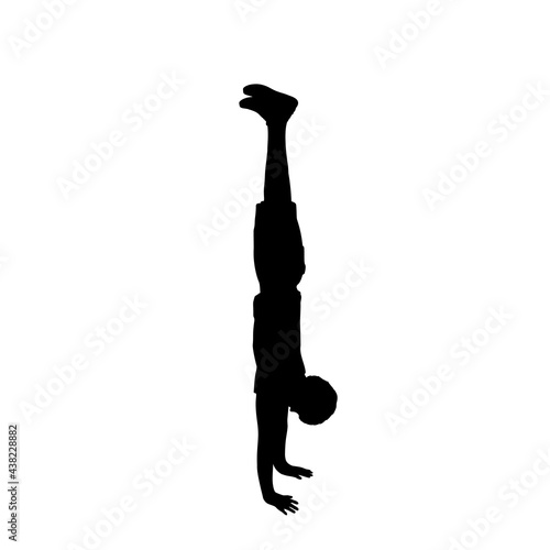 Silhouette boy pose Handstand sideways. photo