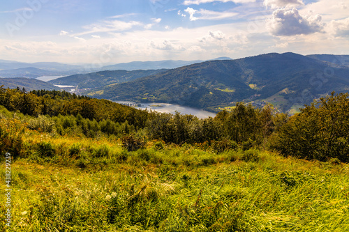 Panoramic view of Beskidy Mountains surrounding Zywieckie and Miedzybrodzkie Lake seen from Gora Zar mountain near Zywiec in Silesia region of Poland