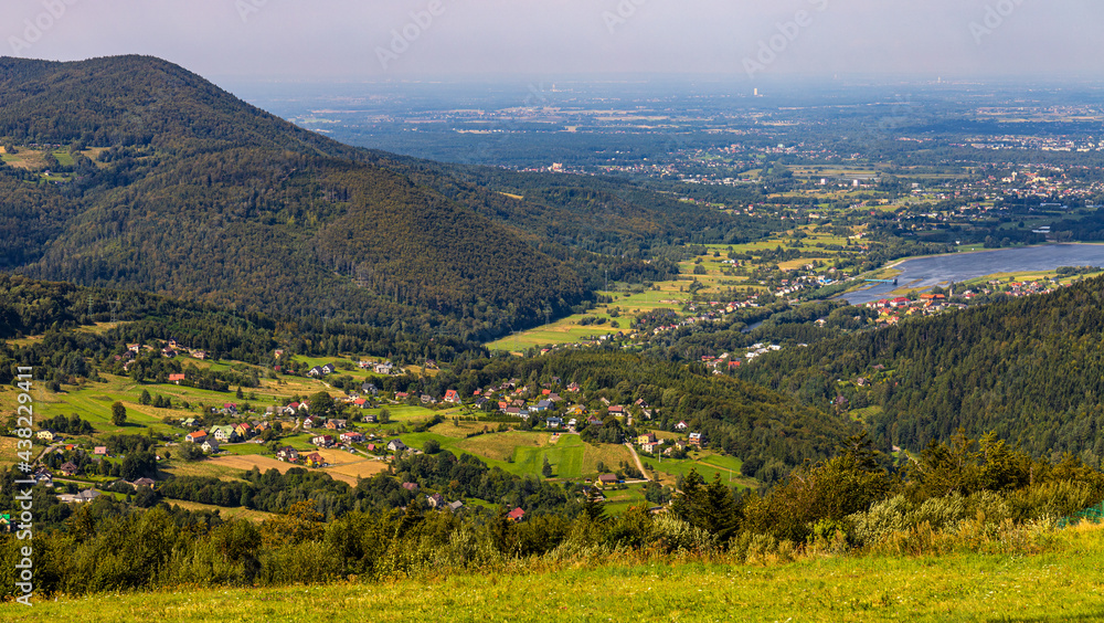 Panoramic view of Beskidy Mountains surrounding Miedzybrodzkie Lake and Porabka town seen from Gora Zar mountain near Zywiec in Silesia region of Poland