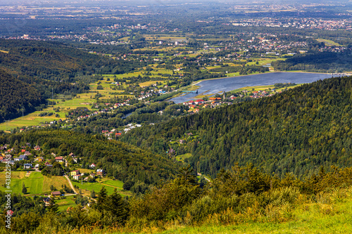 Fototapeta Naklejka Na Ścianę i Meble -  Panoramic view of Beskidy Mountains surrounding Miedzybrodzkie Lake and Porabka town seen from Gora Zar mountain near Zywiec in Silesia region of Poland