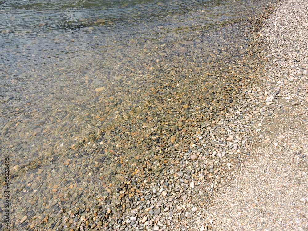 Close up Sunny Beach pebbles sands rock lake Close up Sunny Beach pebbles sands rock lake