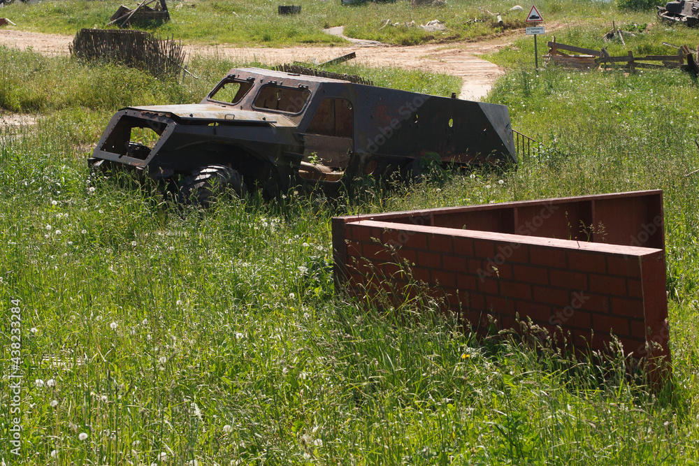 The skeleton of an old ruined armored car in a war zone
The skeleton of an old ruined armored car in a war zone