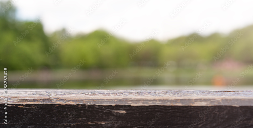 Fototapeta premium Old brown board on the lake background