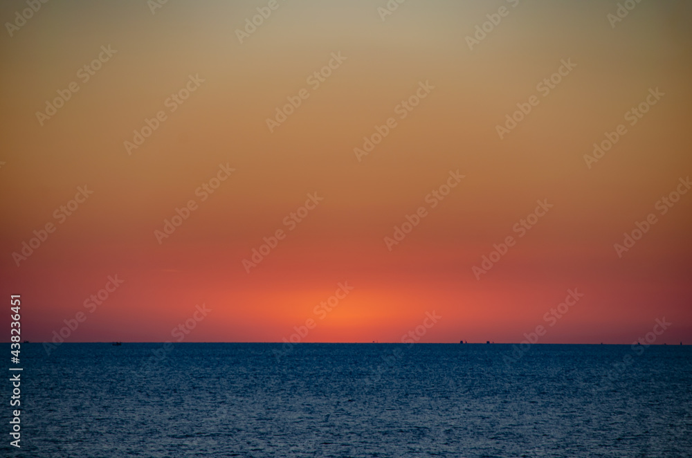 Beautiful sunset on the sea with soft focus and noise.